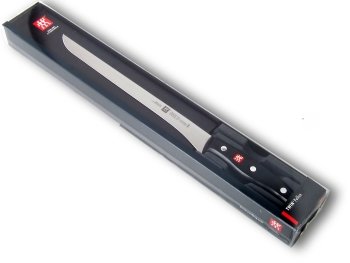 Pollux ham carving knive in its plastic-covered cardboard box